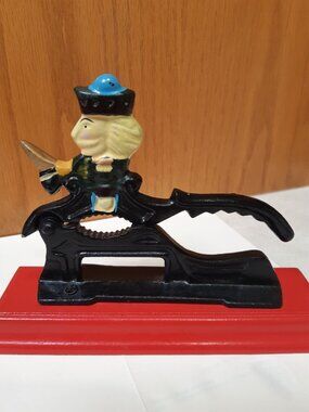 Vintage Heavy Metal Cast Iron Nutcracker with wood base painted red, Folk Art ,